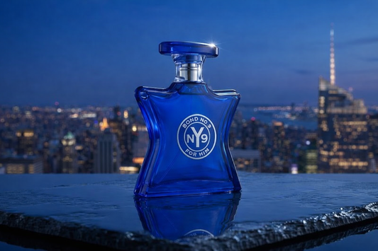 Blue perfume bottle with 'NY9' The Scent of Peace label on a reflective surface at night, cityscape in the background